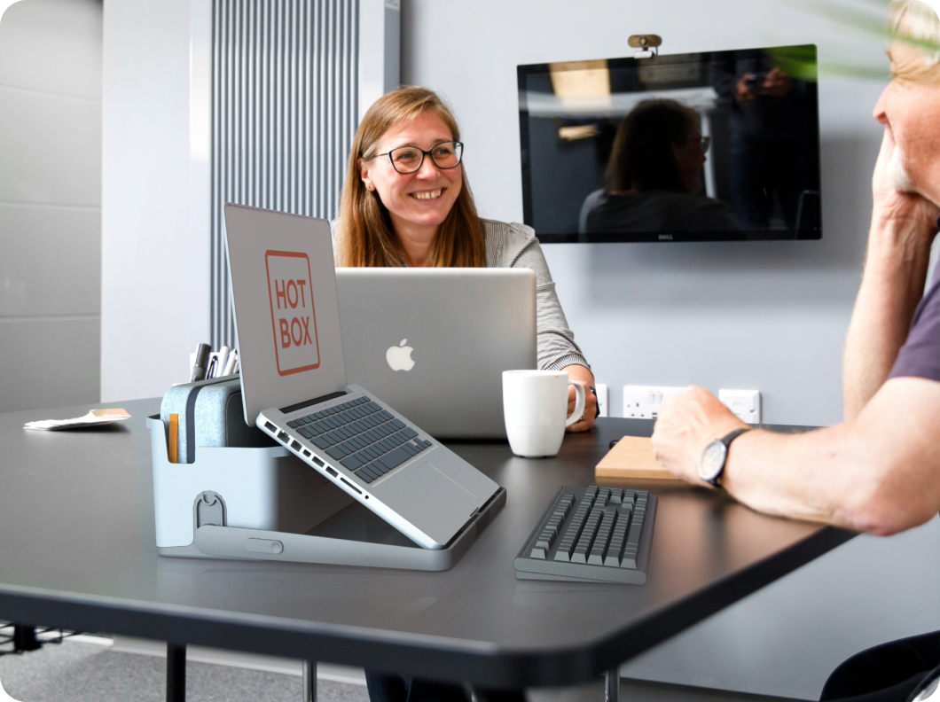 A hotbox 4 with laptop on an office meeting room table