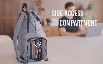 A Hotbox Shuttle backpack sits on a desk in a co-working space